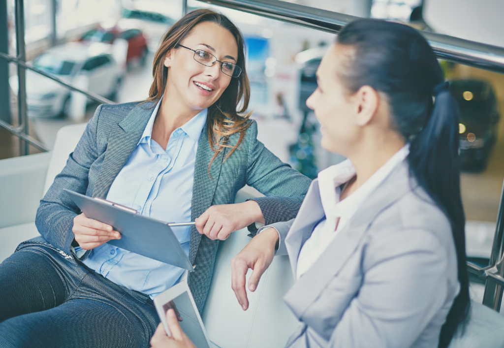 Two salespeople talking to each other
