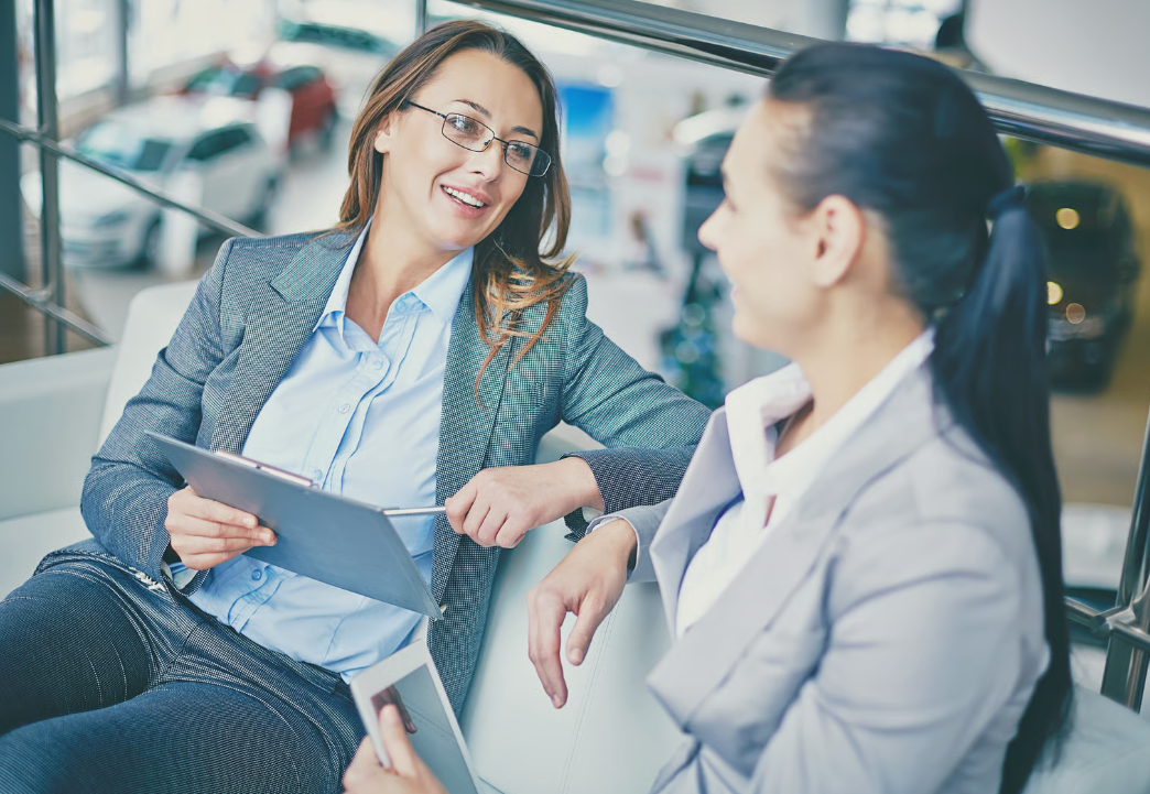 Two salespeople talking to each other