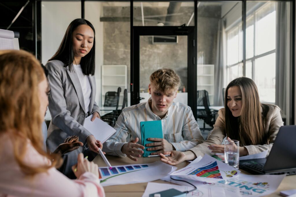 Marketing professionals discussing campaign strategy during a collaborative workplace meeting